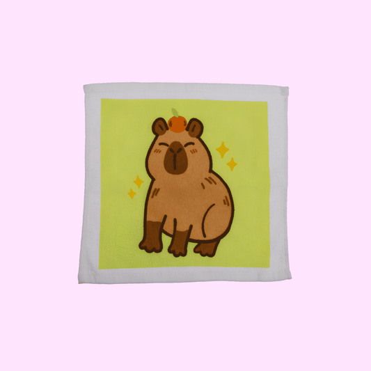 Capybara - Magisches Baumwollhandtuch 30x30cm - Capybara mit grünem Hintergrund - SNACKS24.AT
